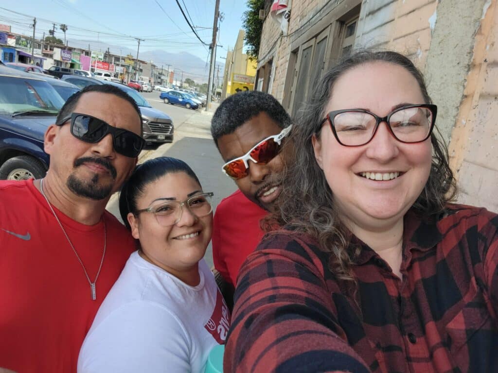 4 people walking the streets of Ensenada