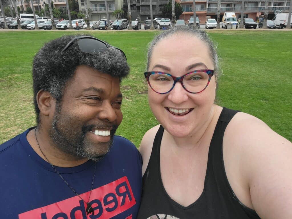 Kevin and Sadie taking a selfie on the grass near La Jolla Cove